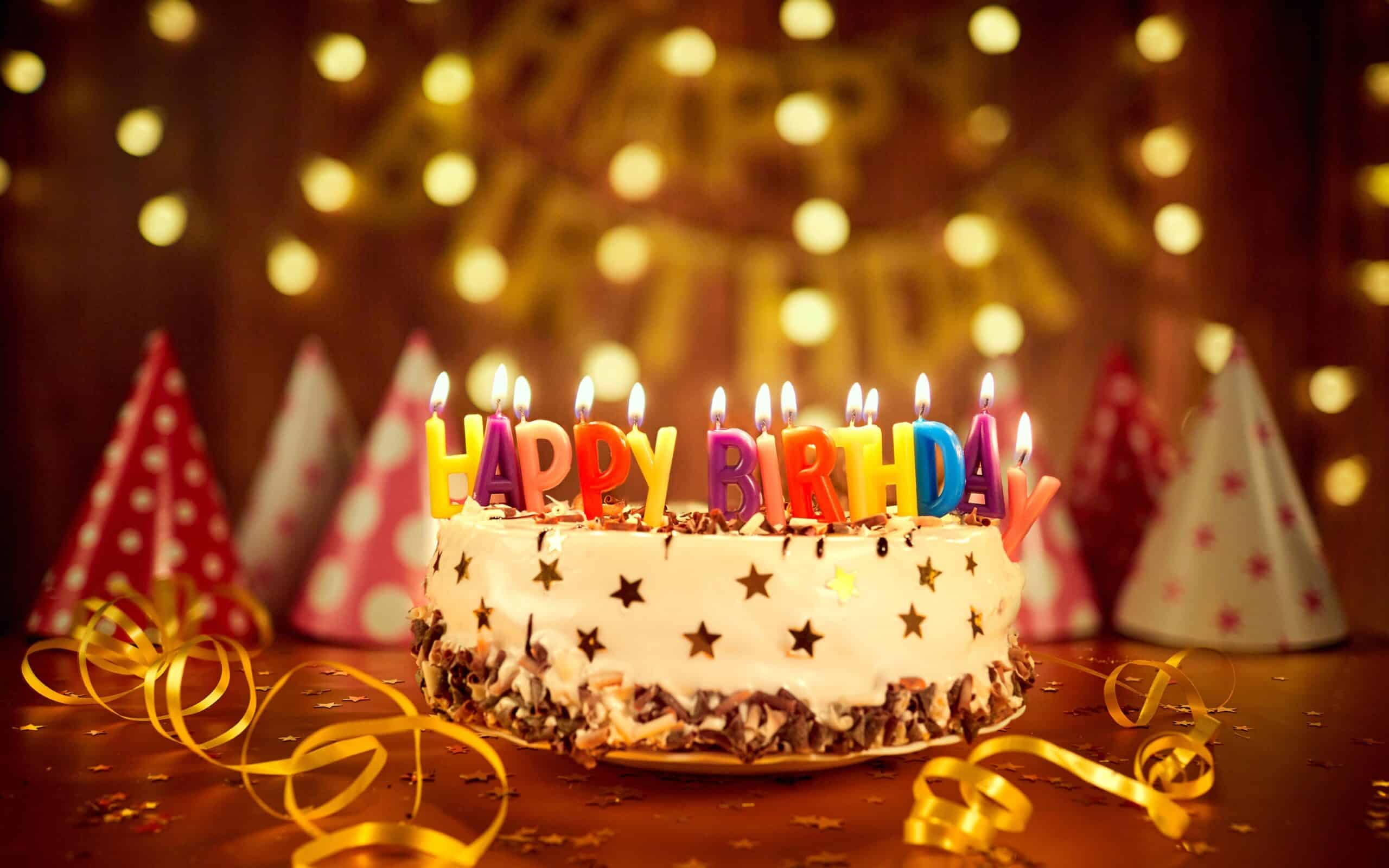 happy birthday cake colorful candles ribbon 2880x1800 scaled